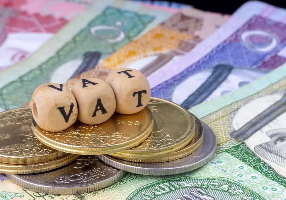 Vat,Concept.,Wooden,Alphabet,Cube,,Riyal,And,Coins,With,Word